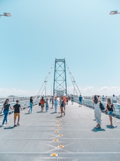 people walking on gray concrete pavement during daytime