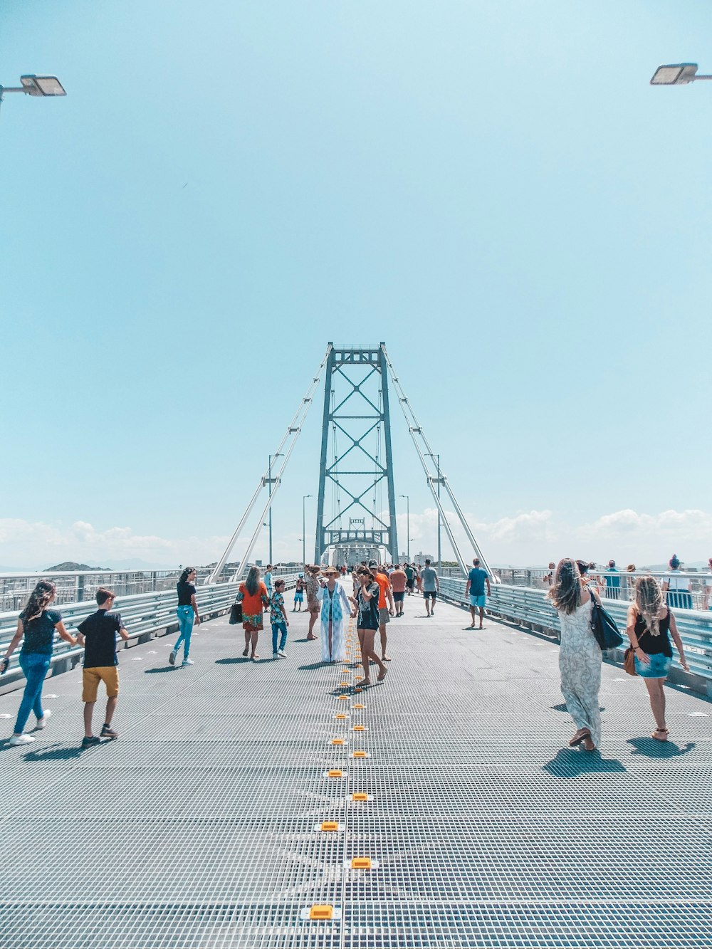 people walking on gray concrete pavement during daytime