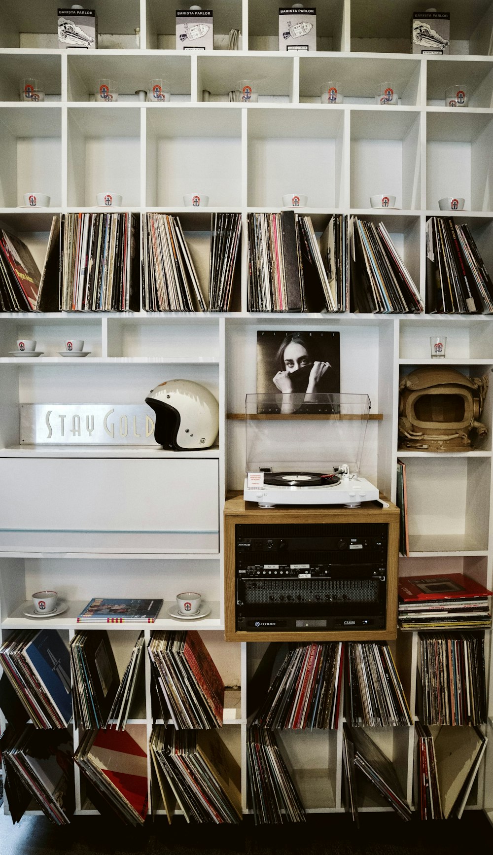 black and white cassette tape player on white wooden shelf