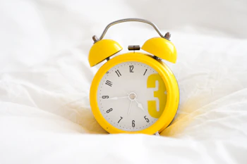 yellow and white alarm clock