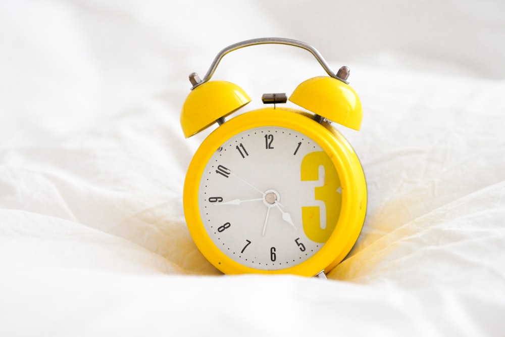 yellow and white alarm clock