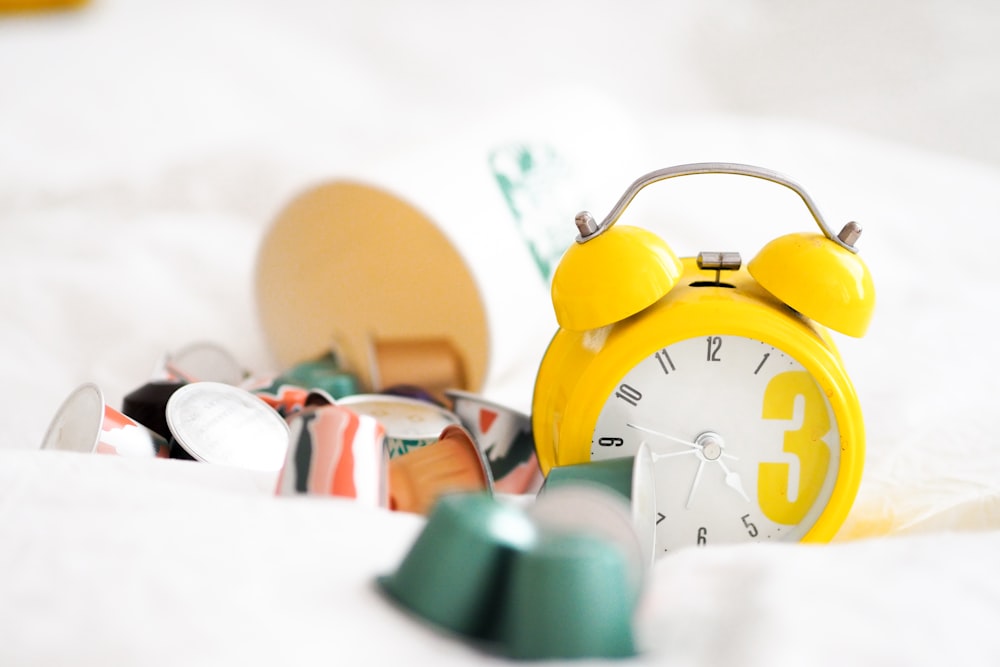 yellow alarm clock at 10 00