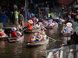 people riding on boat on river during daytime