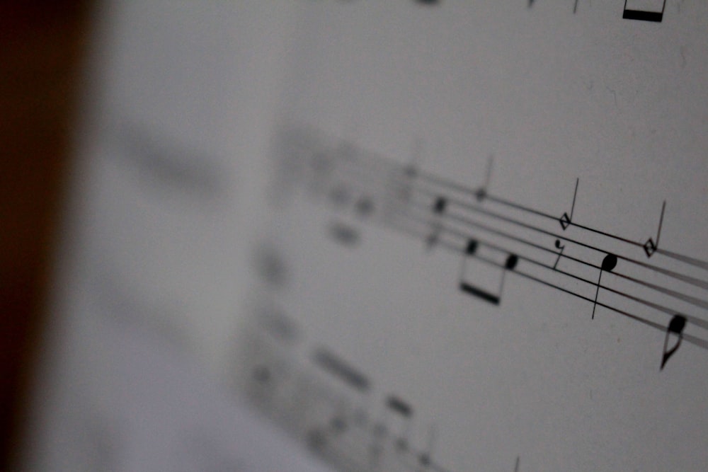white musical notes on white paper