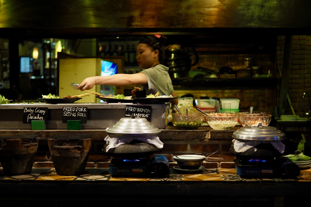 man in white t-shirt cooking