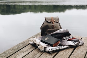 black and white scarf on brown wooden dock