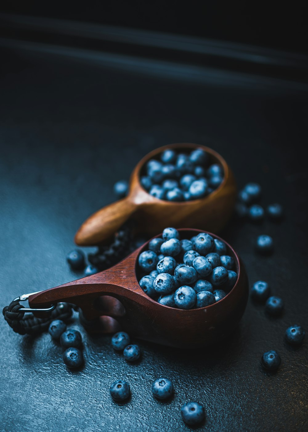 brown wooden spoon with blue beads