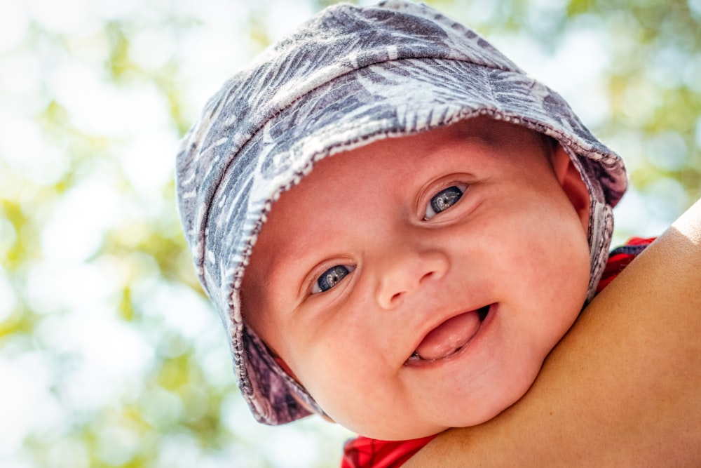 child wearing gray knit cap