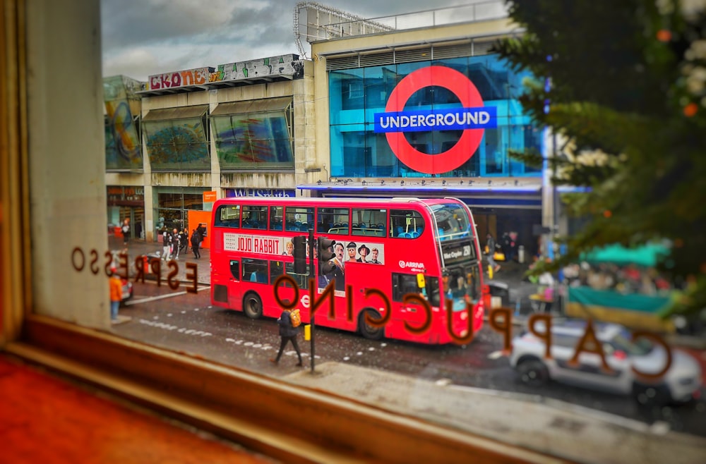 red double decker bus on road during daytime