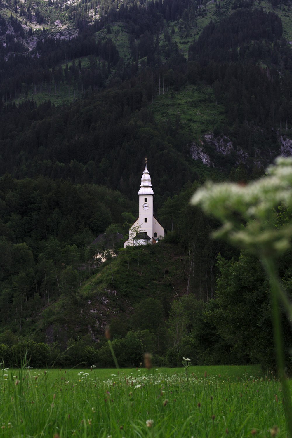 white concrete tower on top of mountain