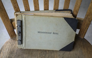 a book sitting on top of a wooden chair