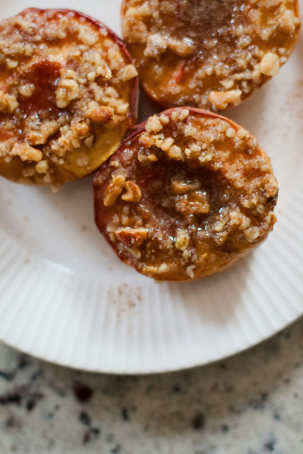 brown and white doughnuts on white ceramic plate