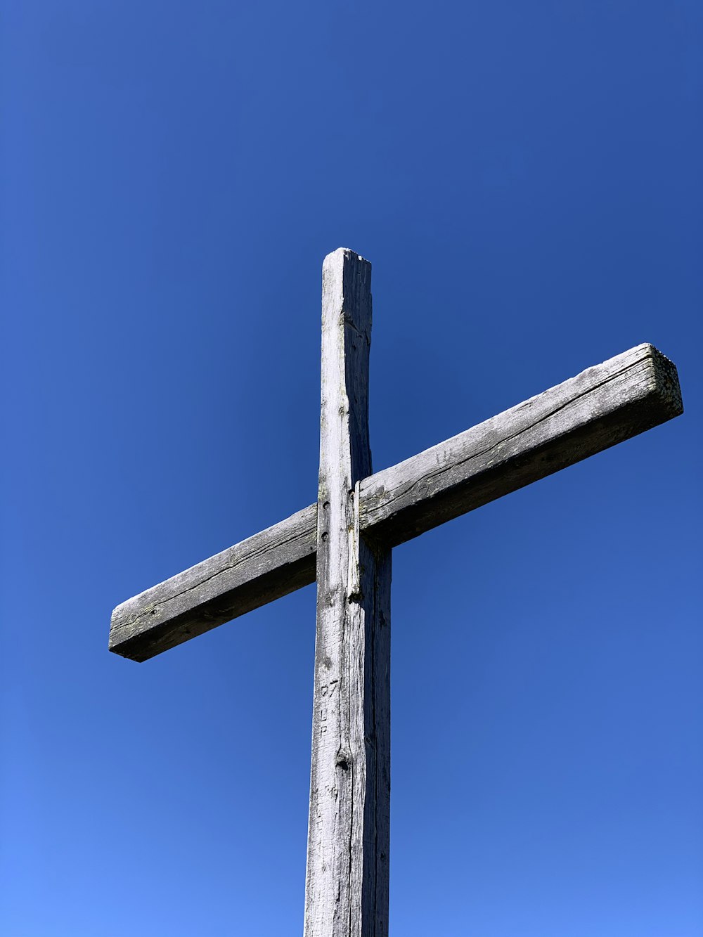 brown wooden cross under blue sky during daytime