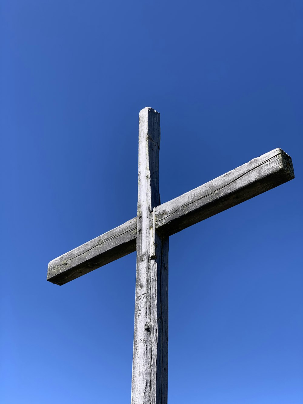 brown wooden cross under blue sky during daytime