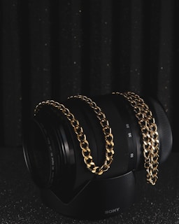 silver bracelet on black surface
