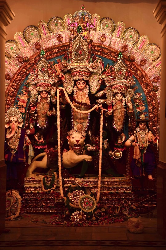 hindu deity figurine on brown wooden table in Jorasanko India