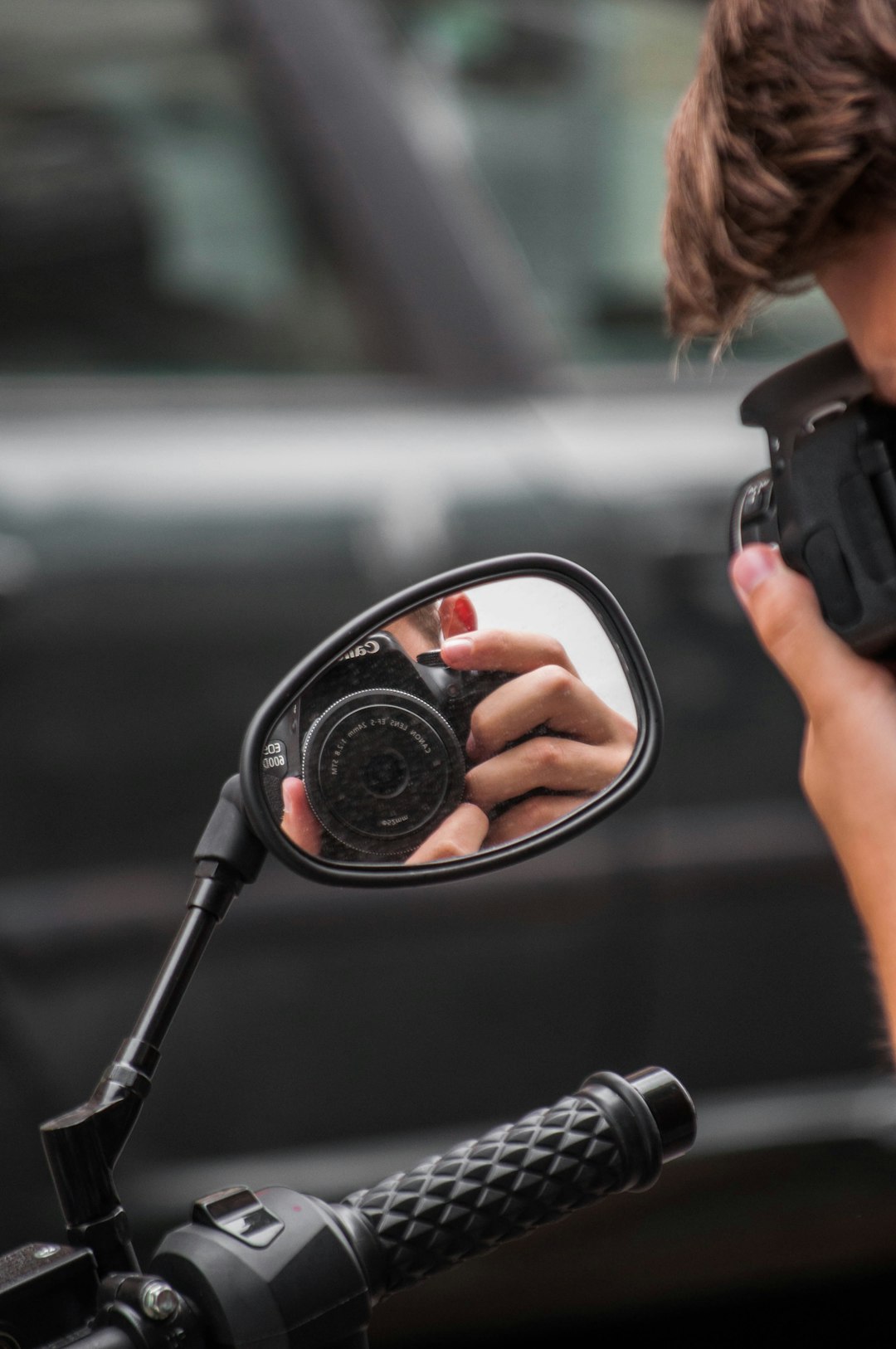 person holding black dslr camera