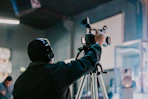 a man holding a camera up to take a picture