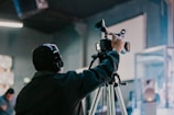 a man holding a camera up to take a picture