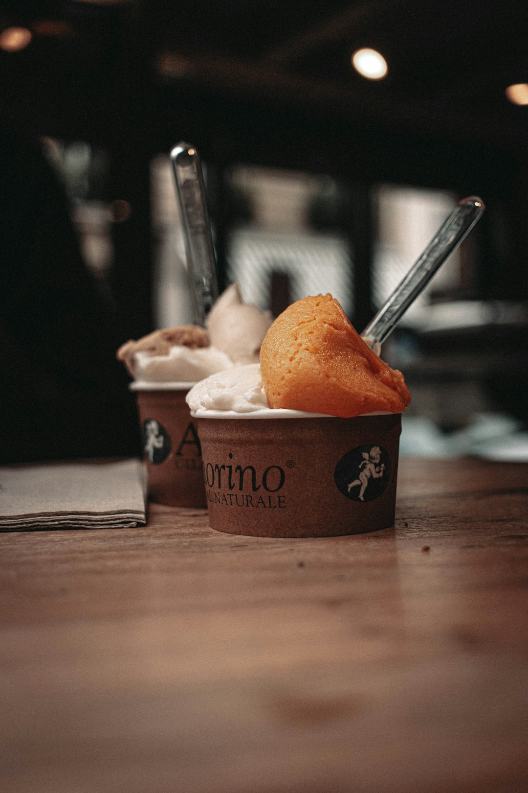 ice cream cup on brown wooden table