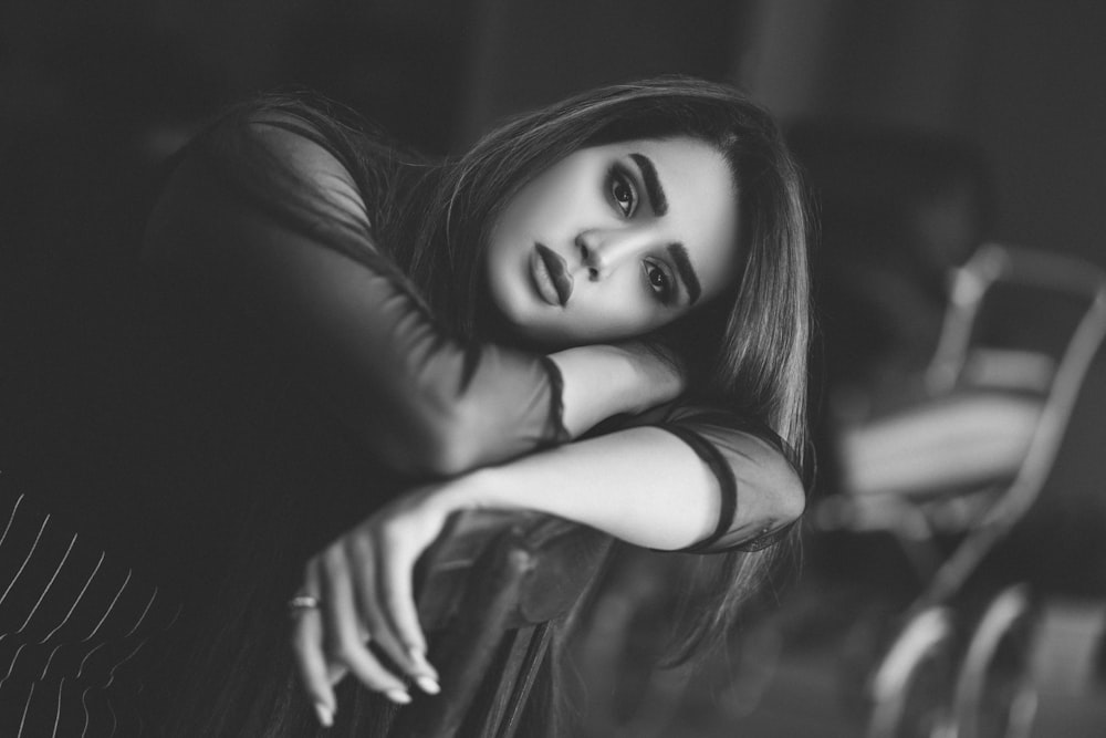 grayscale photo of woman in black sleeveless top