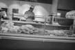 Butcher slicing premium steak in shop