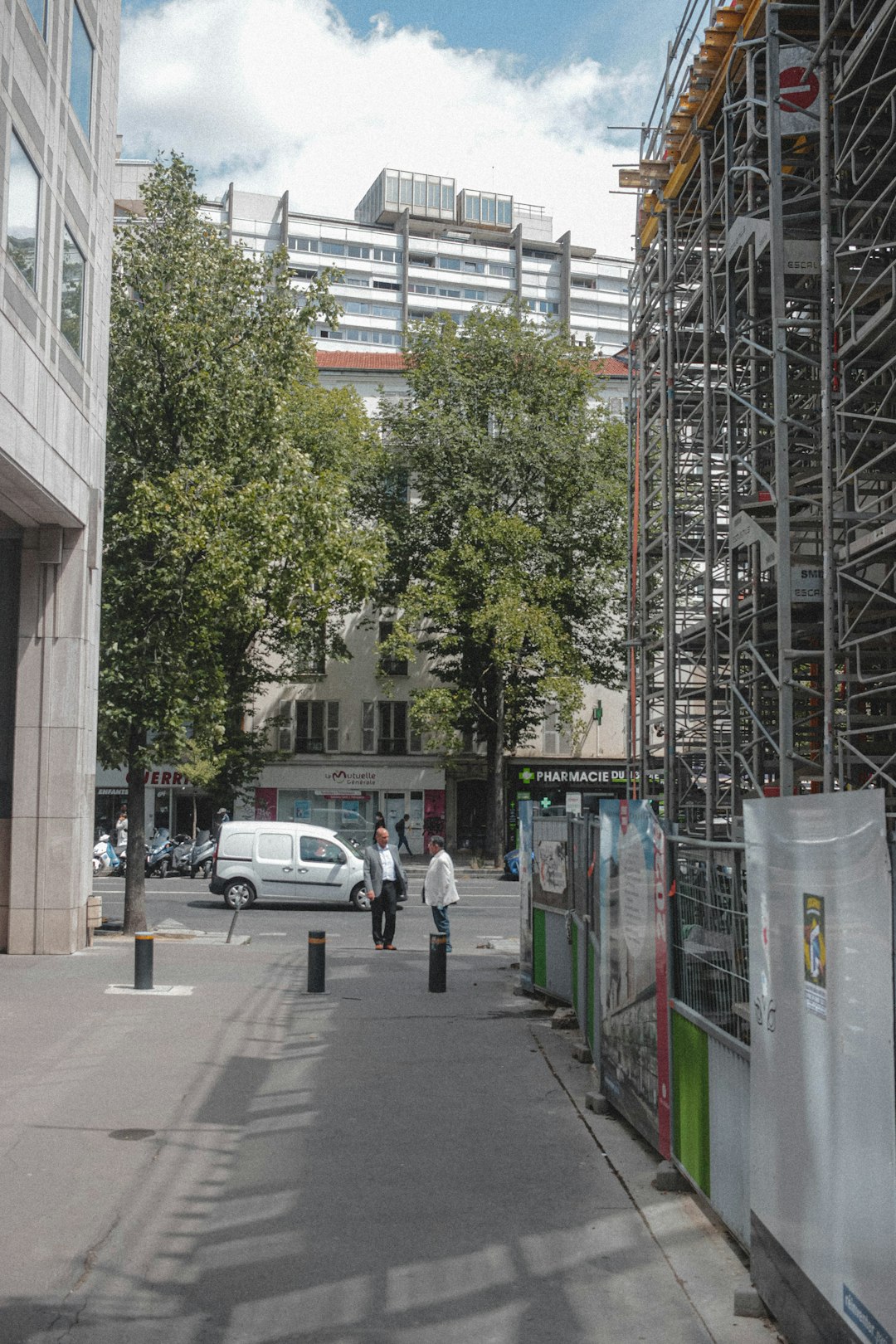 people walking on sidewalk near building during daytime