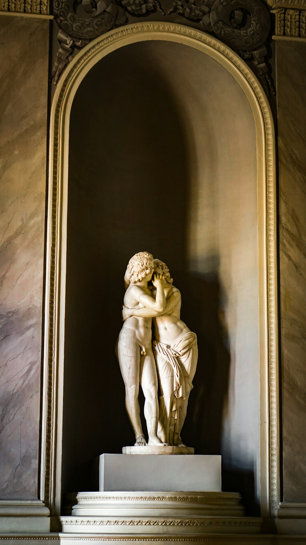 white concrete statue of a man