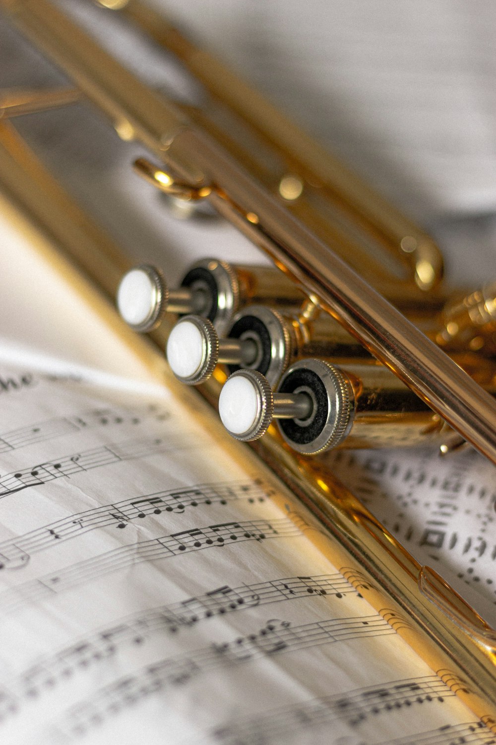 brass trumpet on musical sheet