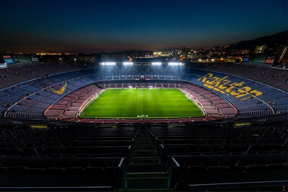 stadium with lights turned on during night time