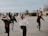 A group of diverse young people engaging in a wellness activity.