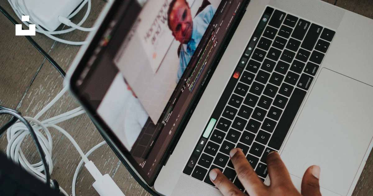 Unsplash Main Using Computer A person using a laptop computer on a table photo – Free Human Image on ...