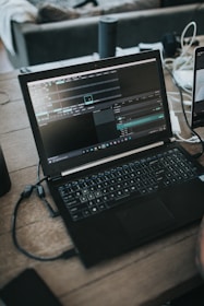 black laptop computer on table