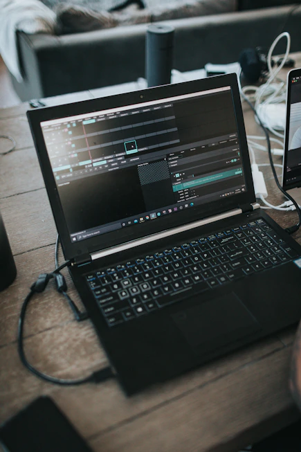 black laptop computer on table