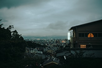 A moody, cinematic photo of Vilnius cityscape glowing under twilight.