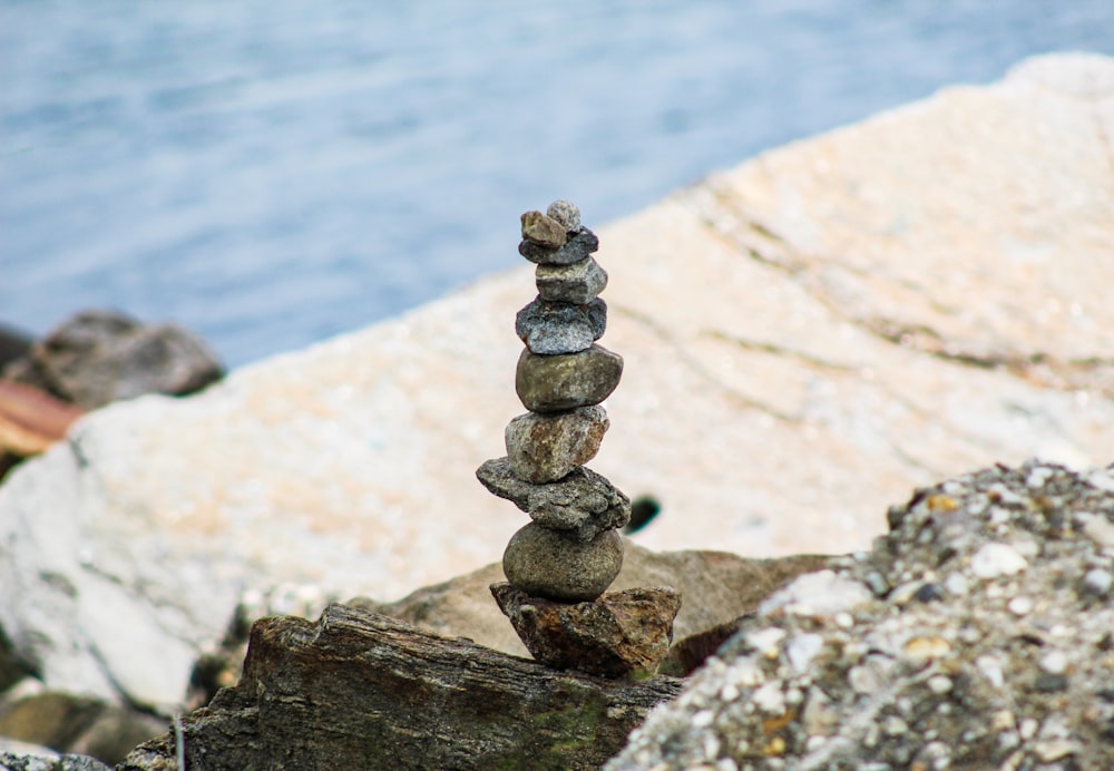 gray stone stack on brown rock
