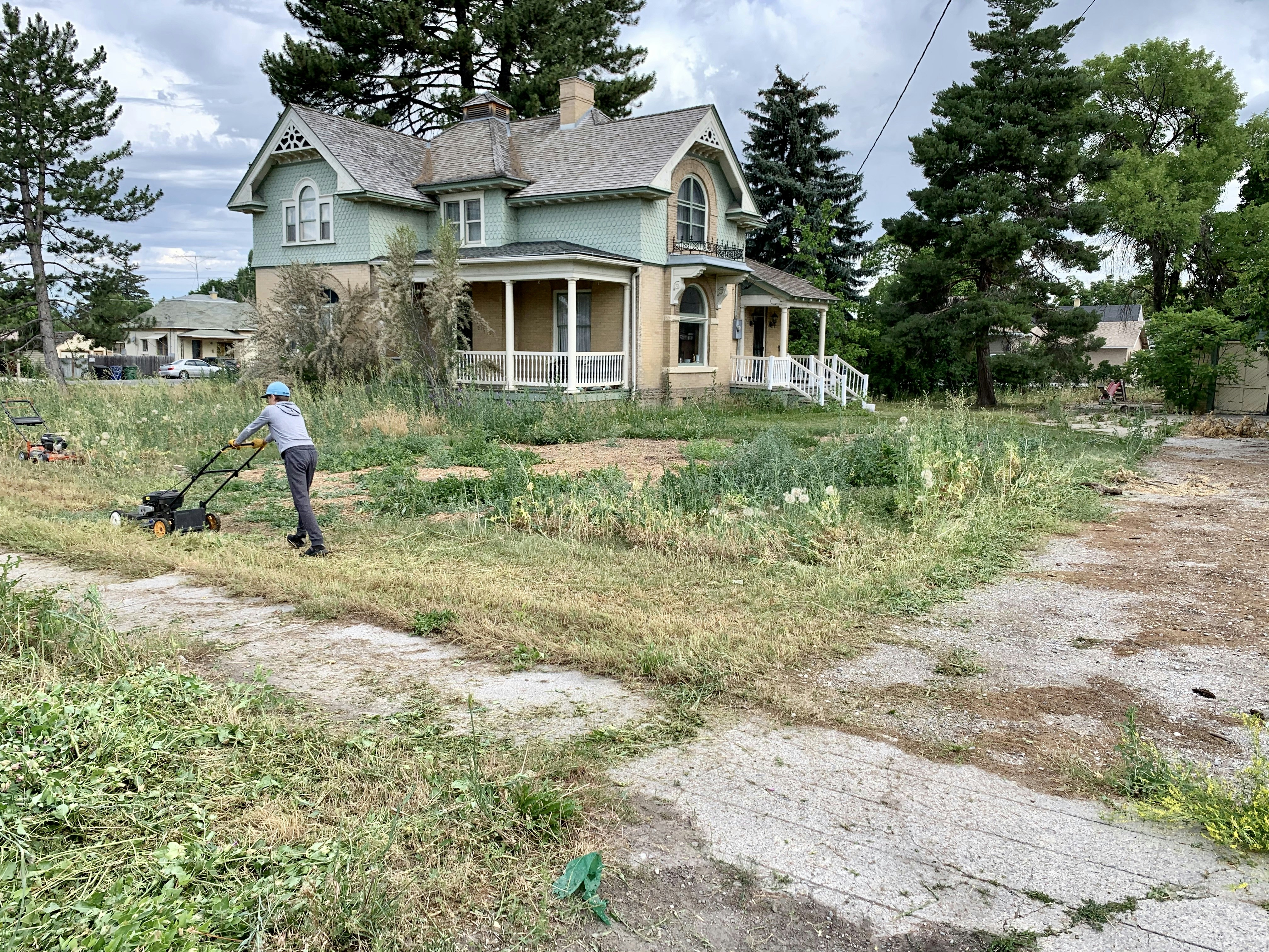Mowing the lawn and weeds of an old historic home in Smithfield Utah. Located at TK Secure Storage in Logan & Brigham City, Utah. www.tksecurestoragelogan.com www.tksecurestoragebc.com