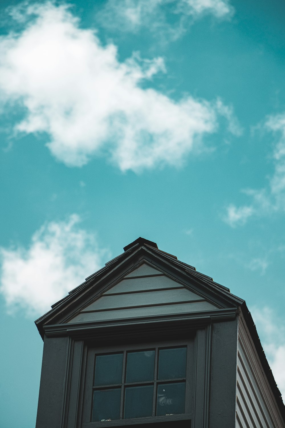 white and black wooden house under blue sky