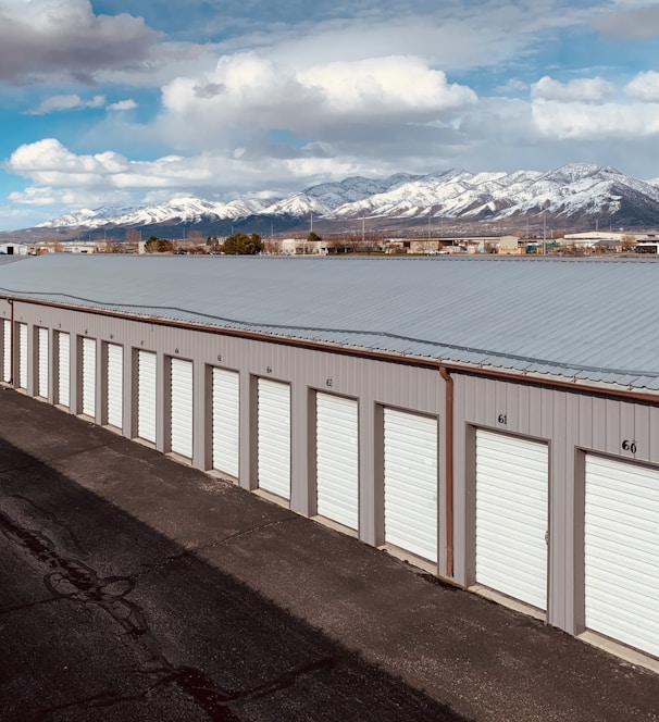 white wooden fence near body of water during daytime