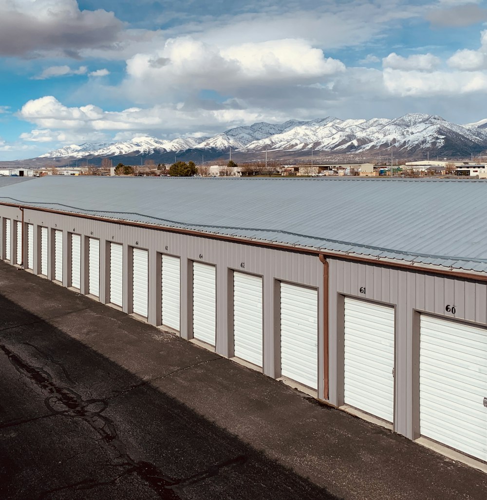 white wooden fence near body of water during daytime