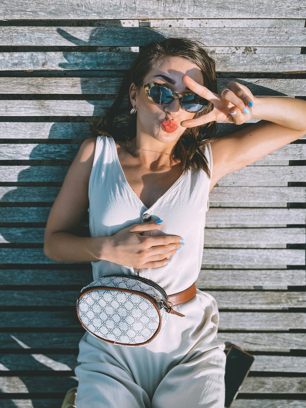 woman in white tank top wearing sunglasses