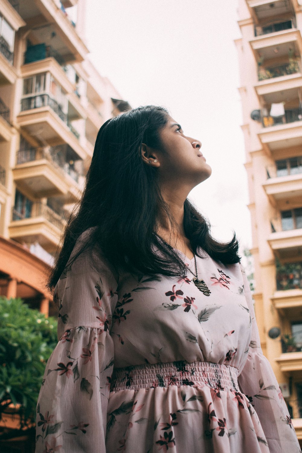 woman in white and pink floral long sleeve shirt