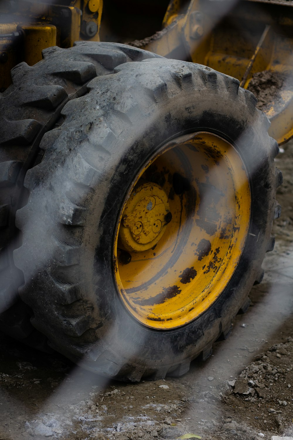 black and yellow wheel on brown soil