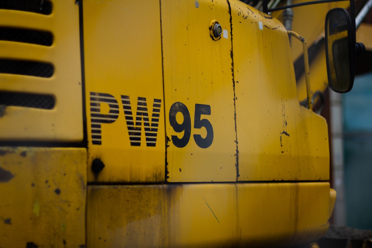 Close-up details of yellow Caterpillar bulldozer heavy equipment on a construction site