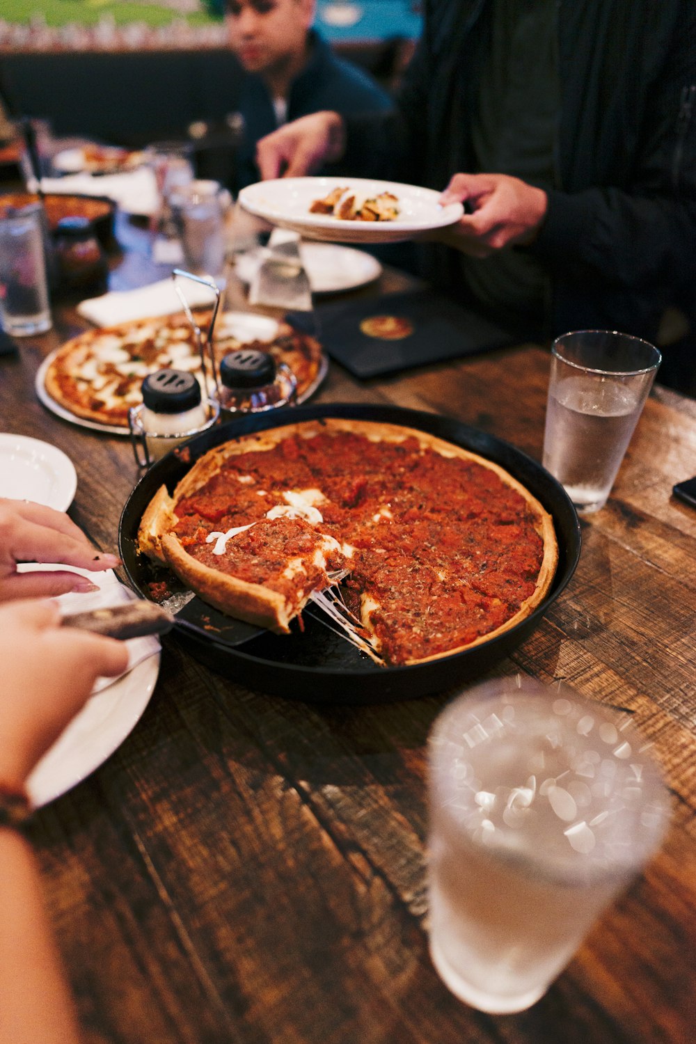 pizza on black ceramic plate