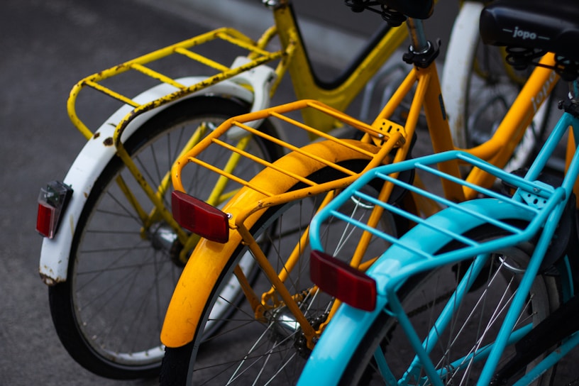 A close-up of colorful bike accessories displayed on a wooden table.