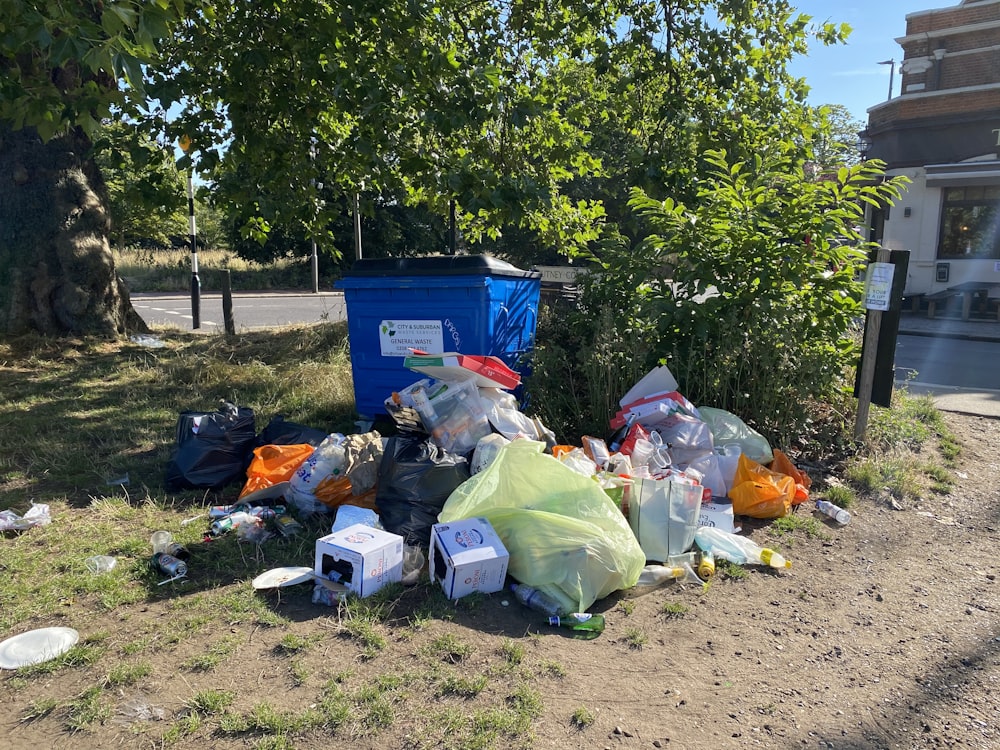 a pile of garbage sitting on the side of a road