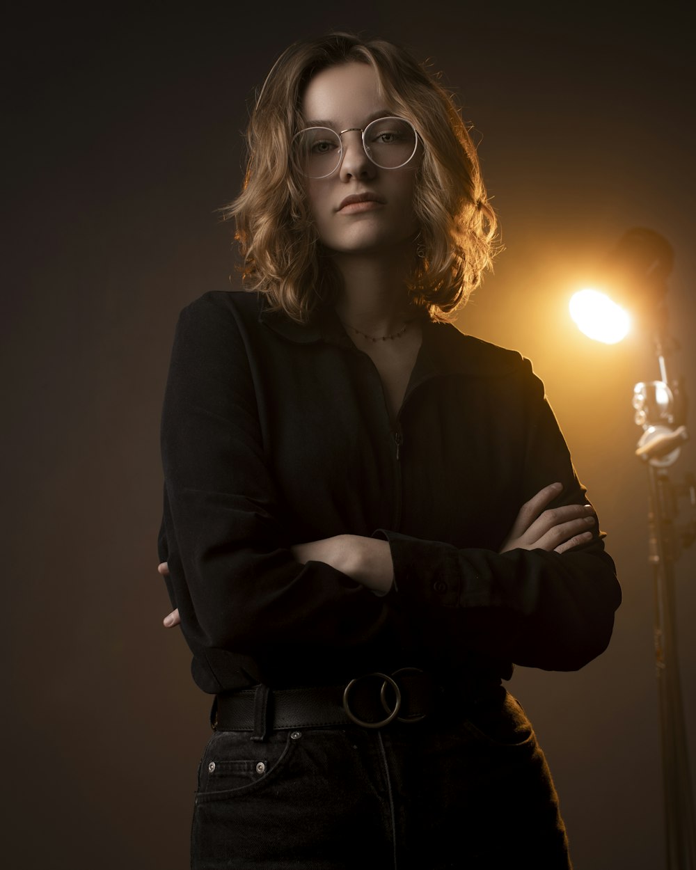 woman in black long sleeve shirt wearing eyeglasses