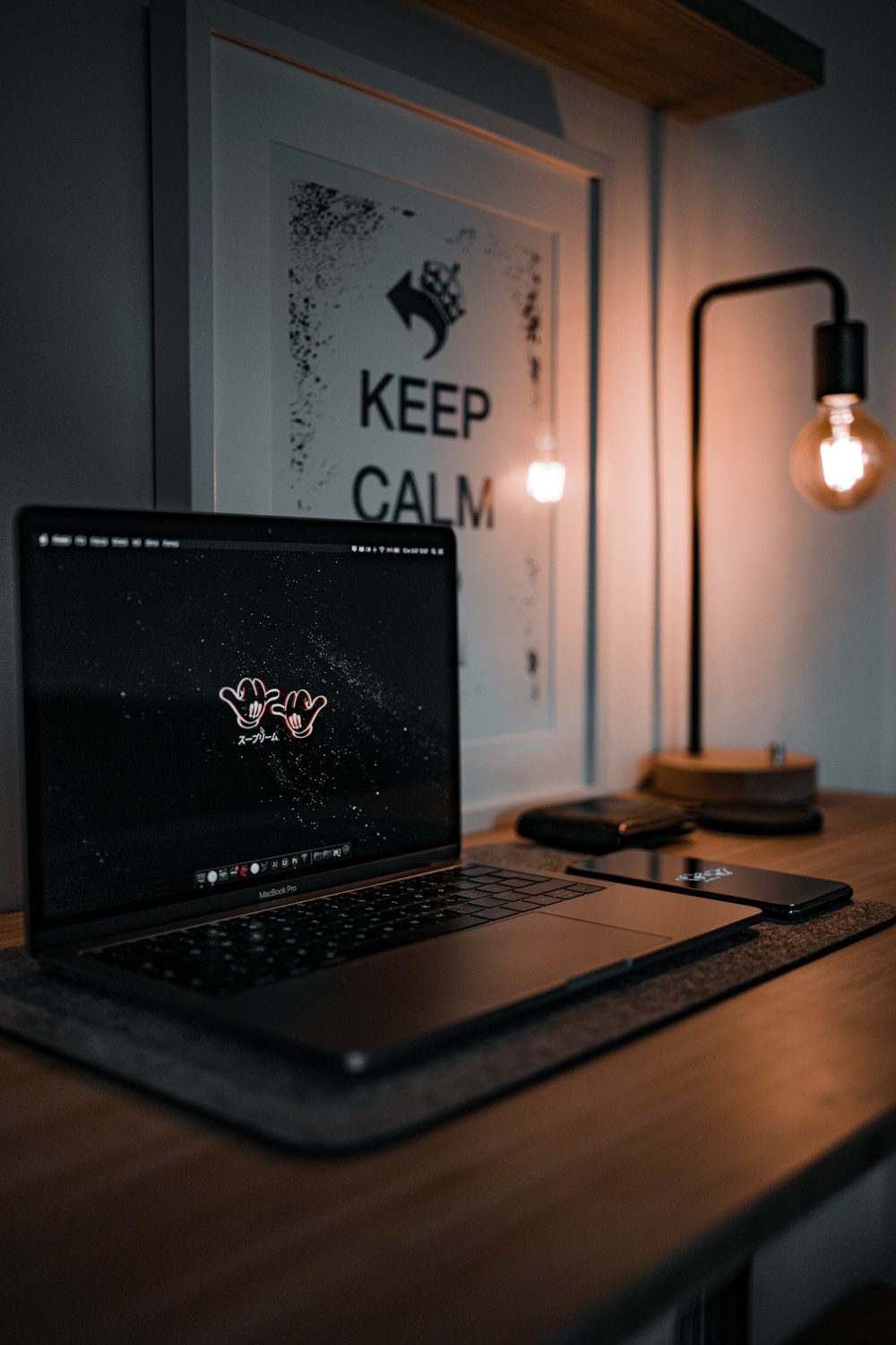 black laptop computer on brown wooden table