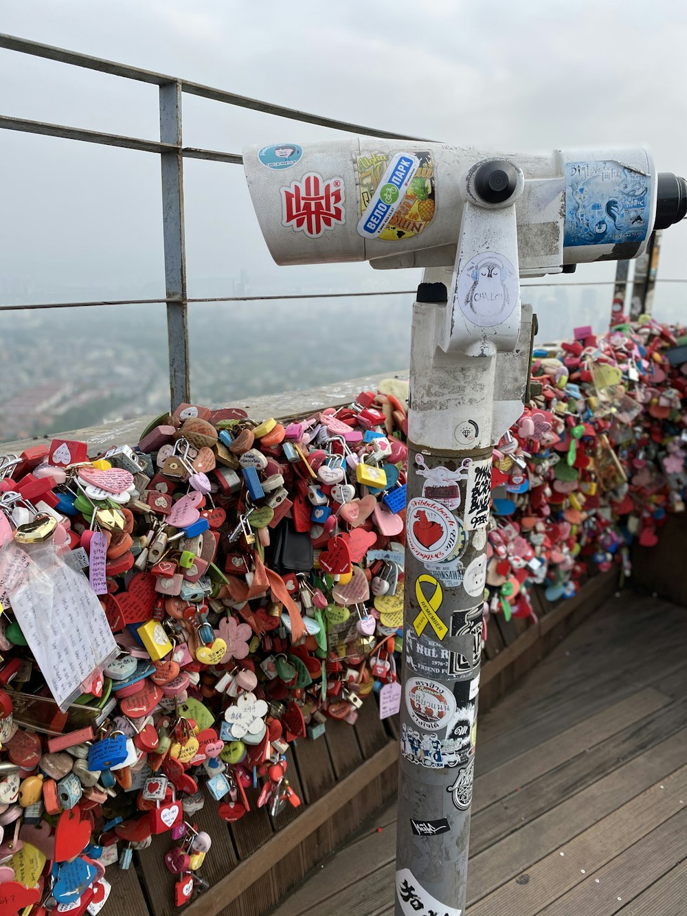 a bunch of love locks attached to a fence